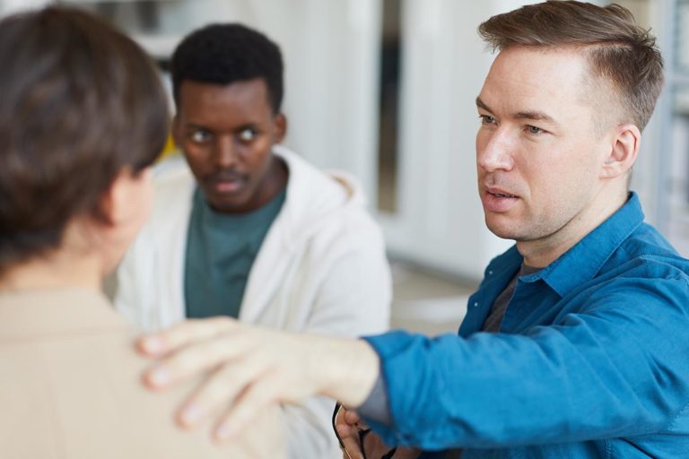 man helps friend with addiction and depression
