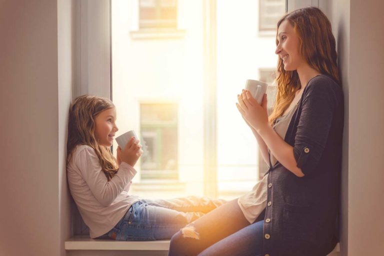 woman and child in window seeing to mental health