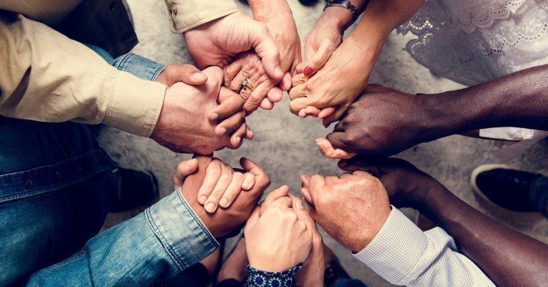 Mental Health Disorders - holistic Support - Group of people holding hands in a circle
