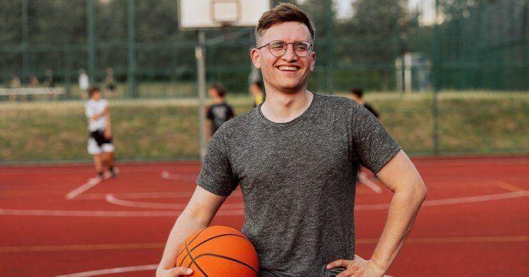 Physical Activity in Addiction Recovery - Man with basket ball on basketball court